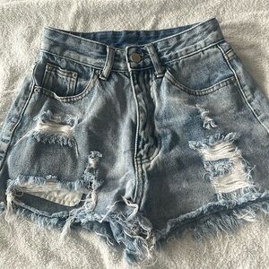 Blue ripped jeans shorts